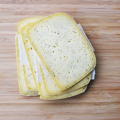 Fromage - Pâte pressée herbes italiennes en tranches